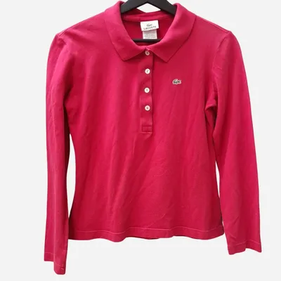 Polo a manica lunga da donna. Marca Lacoste