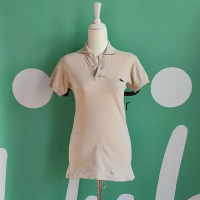 Tshirt polo della marca Lacoste, taglia M